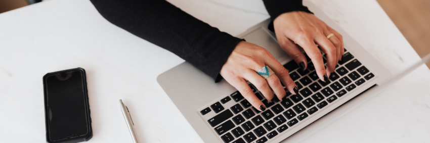 woman typing on laptop