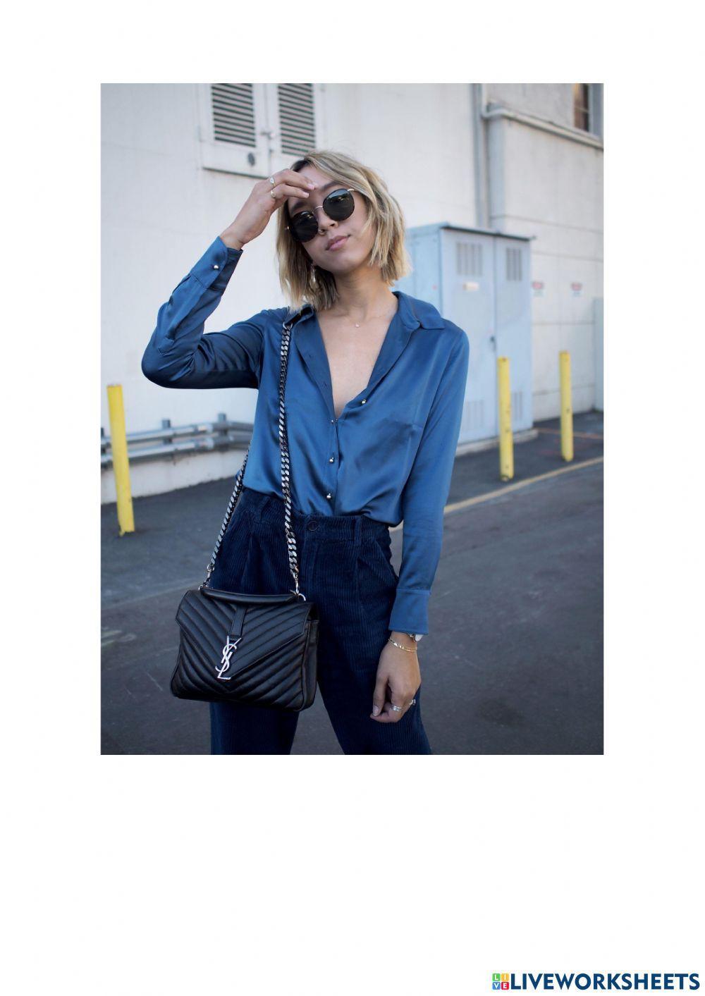 What is he-she wearing?