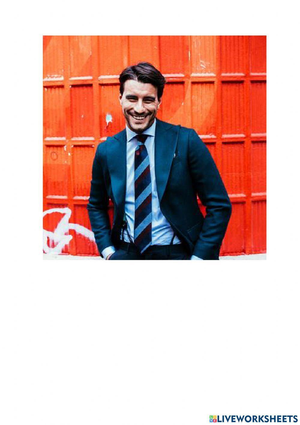 What is he-she wearing?